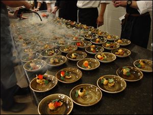 Chris Nixon, of Element 112 in Sylvania, was smoking quail eggs as part of the Toledo versus Cleveland Chef Dinner at the Culinary Vegetable Institute in Milan, Ohio.