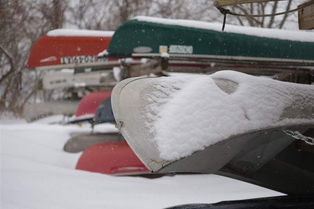 MAG-winterscenes15Canoes-are-covered-in-snow-at-Orlean