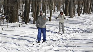 Monclova Township residents David and Lisa Proctor cross-country ski at Oak Openings Metropark in Swanton. The Proctors said they bought the skis to ward off the cabin fever they experienced during last year’s rough weather.