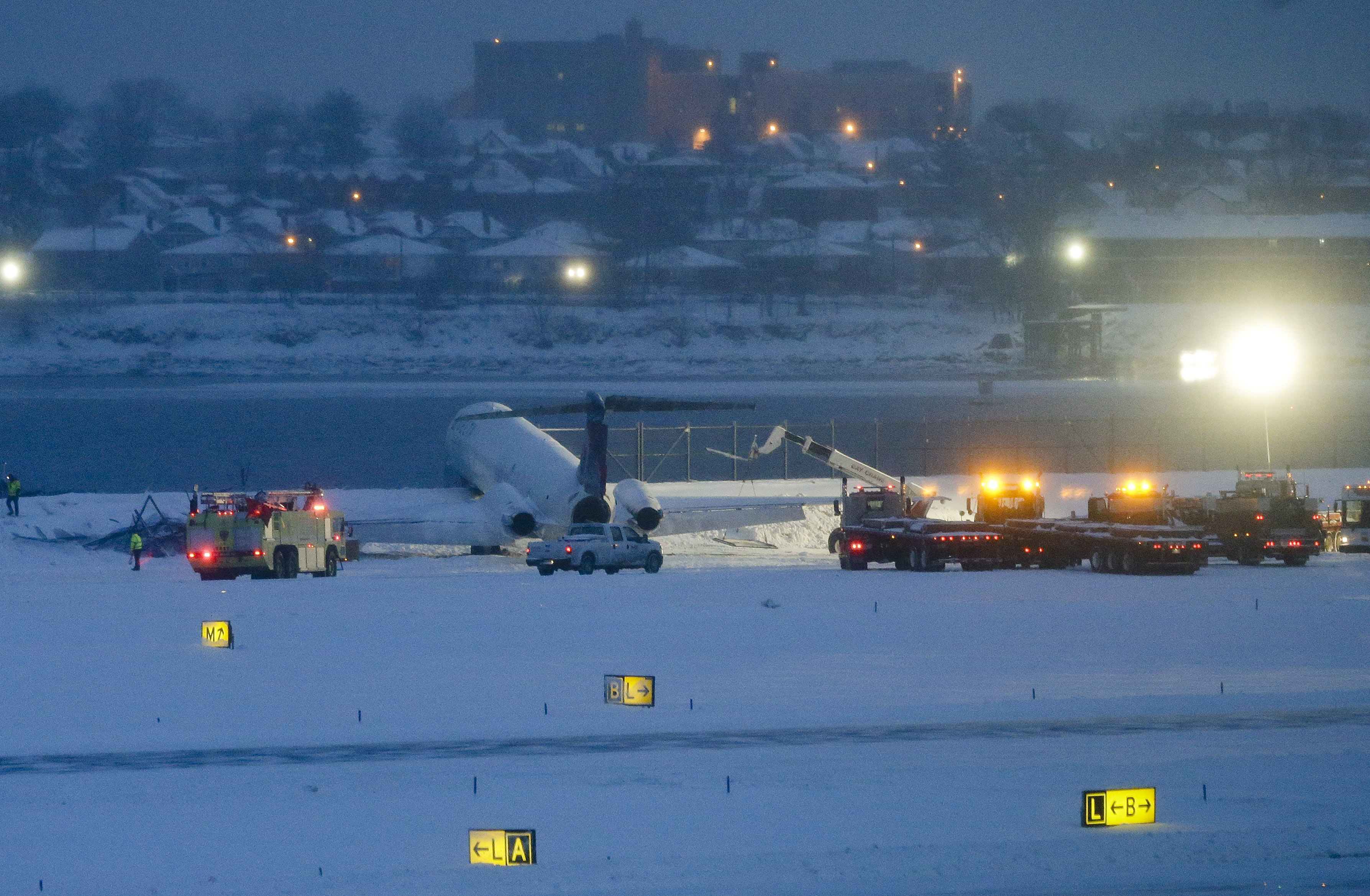 Plane skids off snowy runway at New York's LaGuardia Airport, stops