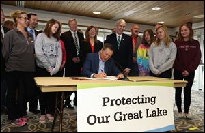 Gov. Kasich signed Senate Bill 1 at Maumee Bay State Park in Oregon.  