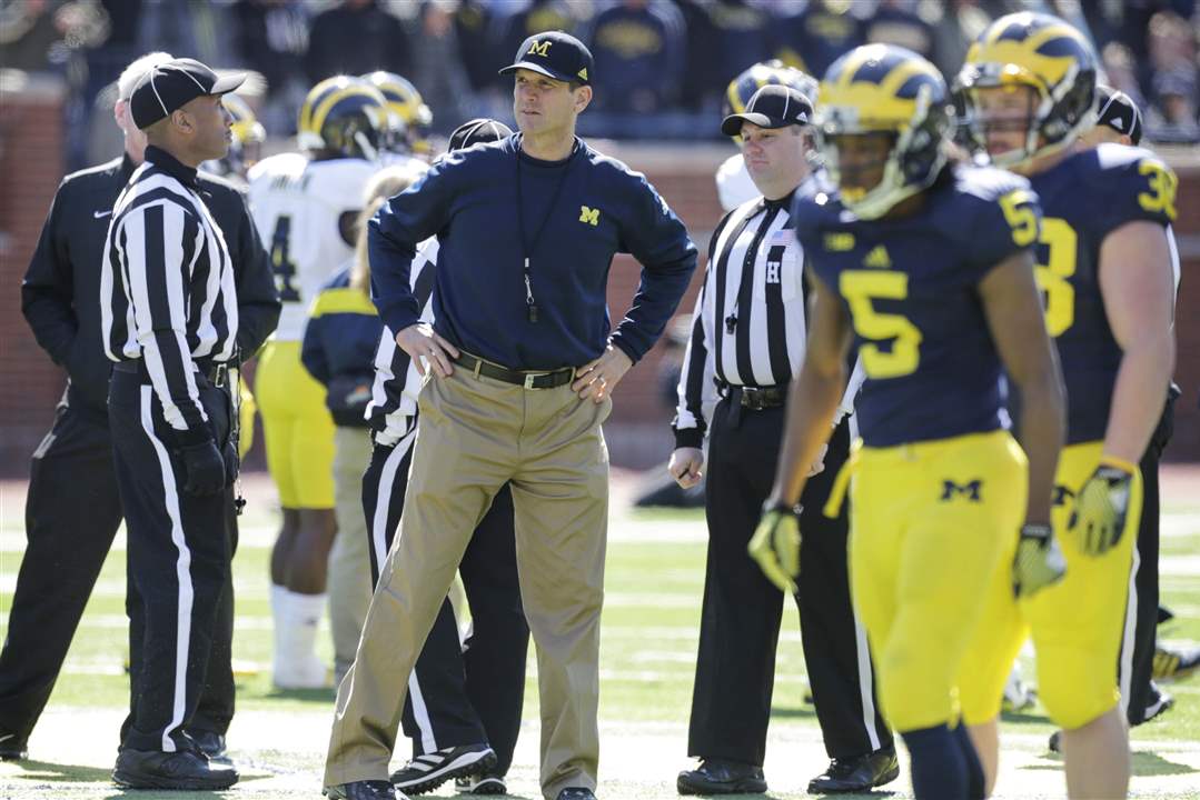 spt-michiganfb-sidelines