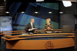 WTVG-TV, Channel 13, news anchors Lee Conklin and Diane Larson on set.