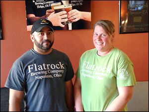 Lawrence Pritchard III and his wife Rachel in the lobby at Flatrock Brewing Company Taproom & Bottle Shop.
