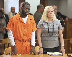  Jermaine Smith, with attorney Jane Roman, is sentenced Friday in Lucas County Common Pleas Court. 