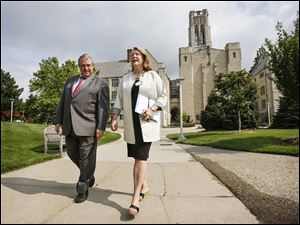 University of Toledo President Sharon Gaber, right, and interim provost John Barrett,  walk across UT’s campus to a meeting at the student union with success coaches. 