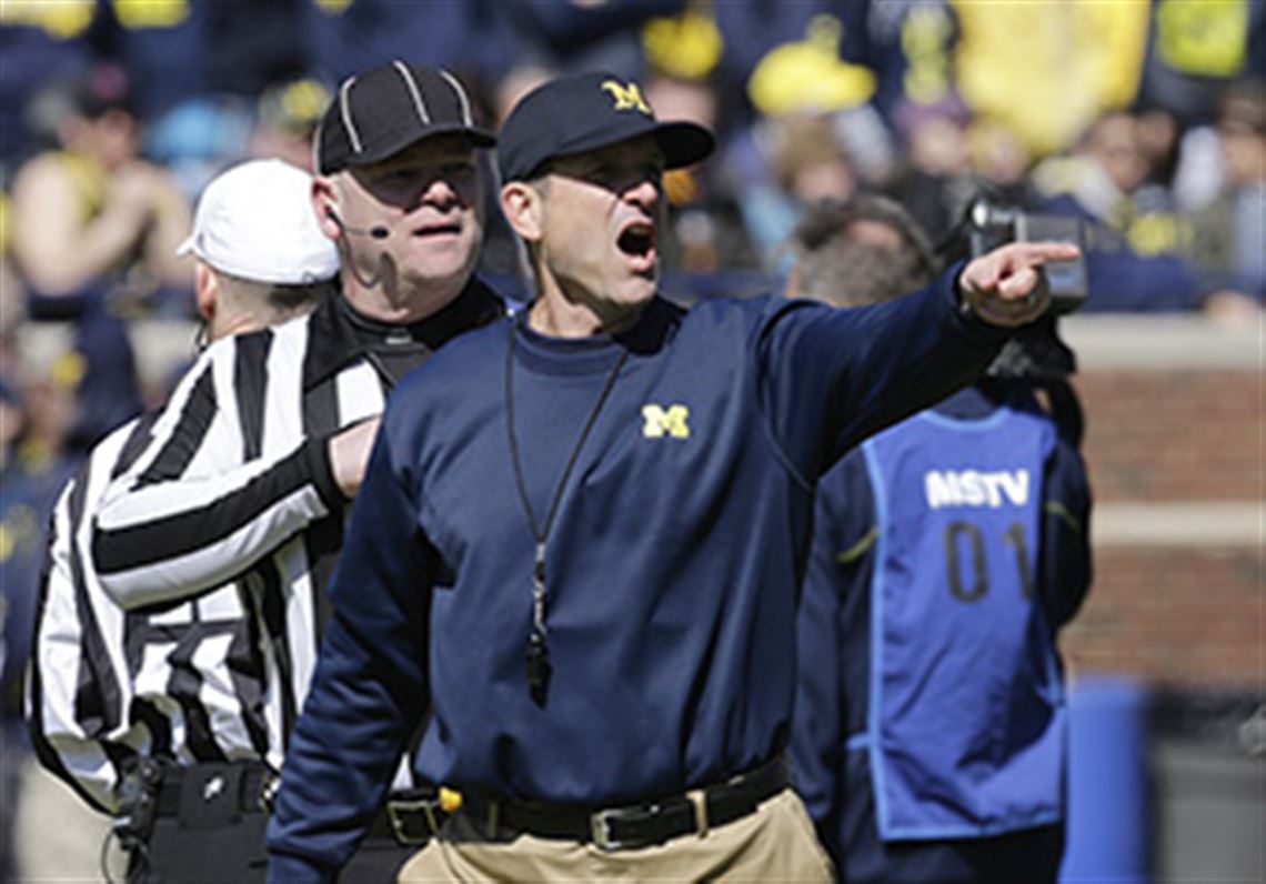 Michigan head coach Jim Harbaugh and the Wolverines open the season at Utah on Sept. 3