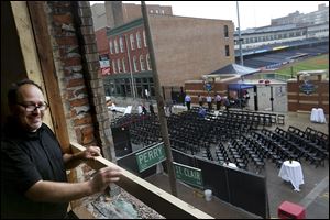 Assistant general manager of Ye Olde Durty Bird KC Saint John looks at Fifth Third Field from 28 N. St. Clair St.