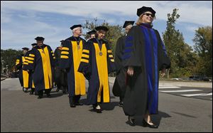 Sharon Gaber leads trustees and faculty in her inauguration procession from the Student Union to Savage Arena at the University of Toledo, where she was formally installed.