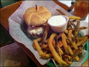 The Greek Burger and french fries from Berger's Olde Tyme Bar and Grill.