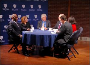 Toledo mayoral candidates from left, Mike Bell, Sandy Spang, and Mike Ferner, talk with Blade reporters Keith Burris, Marlene Harris-Taylor and Ignazio Messina, during a 