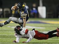 Whitmer runs by McKinley
