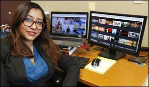 Monita Karmakar, a co-author of the University of Toledo research study, shows Hulu and Netflix on her computer at the Center for Health and Successful Living office at UT. 