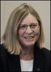 Collins seeks workers comp in husband's death