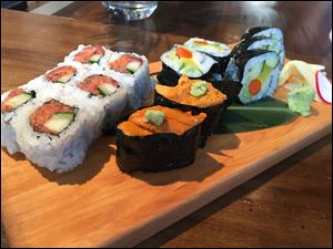 Spicy tuna roll, uni nigiri, and vegan roll from Kengo Sushi & Yakitori on St. Clair St. in downtown Toledo.