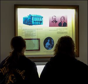Bowling Green State University student Brenda Gillig, of Risingsun, Ohio, left, and her aunt, Suzette Pelton, of Bowling Green, look at an exhibit about the 19th president. The Rutherford B. Hayes Presidential Library and Museums closed on Sunday until May.
