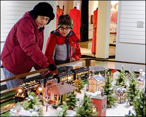 Marian Grahl of Clyde and her grandson Brandon Grahl, 10, of Fremont view the Hayes Train Special at the Rutherford B. Hayes Presidential Library and Museums.