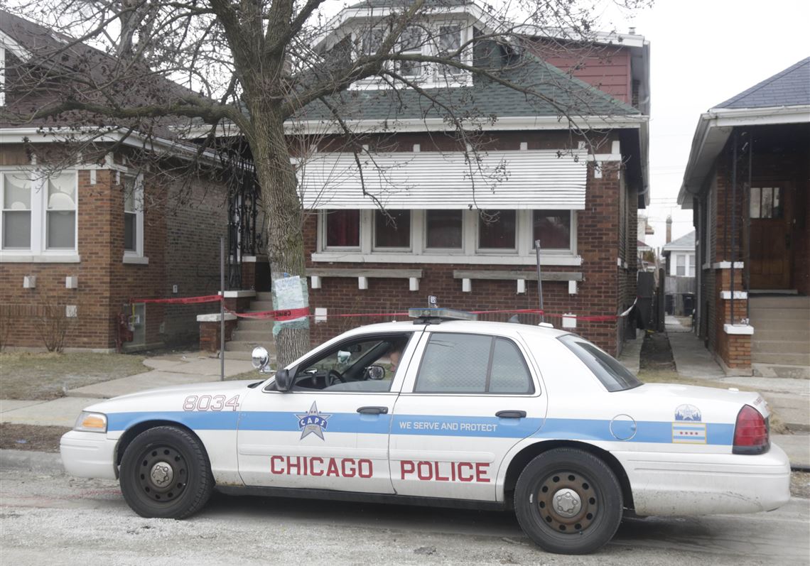 Crime scene tape surrounds a home in Chicago.