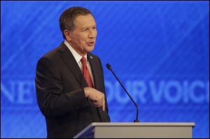 Republican presidential candidate, Ohio Gov. John Kasich makes a point during a Republican presidential primary debate hosted by ABC News at St. Anselm College in Manchester, N.H. 