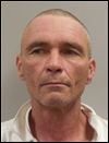 Reward offered for man charged with murder