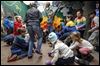 Students play opossum at the zoo on day off school