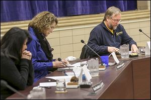 From left, school board Vice President Lisa Canales and interim Superintendent Cherie Mourlam listen to board President David Hunter discuss the decision to uphold former Superintendent Patrick Hickey’s ban from district property on Monday. 