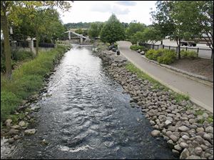 The Fox River flows through Waukesha, Wis., which is seeking permission to draw water from Lake Michigan. Officials say the river can’t meet the city’s needs and wells are contaminated.