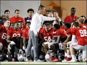 Ohio State football head coach Urban Meyer talks to his team during a 2016 practice at the Woody Hayes Athletic Center. Meyer and Buckeyes have one LL Cool J song on repeat this week before playing Michigan.