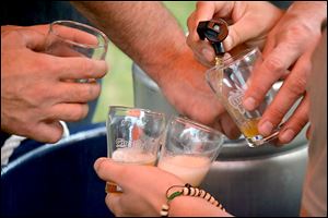 A craft brewer pours a beer at one of the America On Tap festivals. 