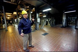 Neil Dziedzic, plant manager at the J.R. Whiting power plant in Monroe County, gives a tour of the coal-fired facility. The power station is one of many being shuttered as markets shift toward natural gas and clean, renewable energy.
