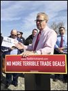 Strickland hammers Portman on trade