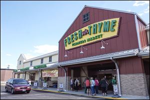 Fresh Thyme Farmers Market takes over the 30,000 square-foot space once occupied by Office Depot on Monroe Street.