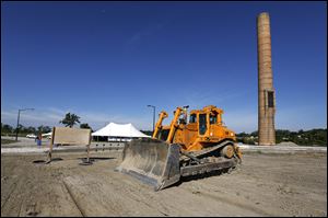 A bulldozer is ready to work on location for the future 100,000-foot structure for automotive parts supplier Detroit Manufacturing Systems, which has signed a seven-year lease for the site at Overland Industrial Park in Toledo.