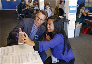 Actor Tim Daly and organizer Gabriella Linardi make a Snapchat after Mr. Daly spoke on behalf of Hillary Clinton in Toledo. Mr. Daly is a star of the TV show ‘Madam Secretary.’