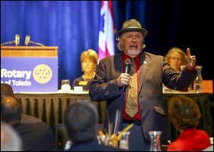 Ken Leslie, a former addict who was himself homeless, speaks at the weekly meeting of the Rotary Club of Toledo in the Grand Ballroom of the Park Inn downtown. He leads efforts to find housing, with a concentration on military veterans.