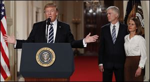 President Trump announces Judge Neil Gorsuch as his nominee for the Supreme Court on Tuesday. Gorsuch stands with his wife, Louise