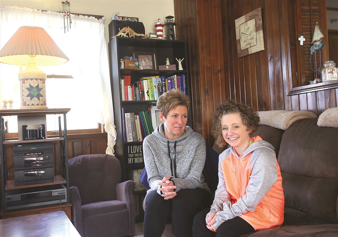 Amy Wilhite, left, and her daughter, Taylor, of Marblehead, Ohio, discuss the proposed repeal of the Affordable Care Act by the Trump Administration.