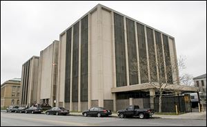 Lucas County commissioners continue to seek a plan to replace the outdated county jail on Spielbusch Avenue.