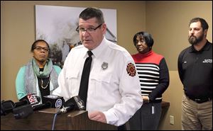  Toledo fire spokesman Sterling Rahe speaks at a news conference. Behind him are Mayor Paula Hicks-Hudson, left, and Councilman Yvonne Harper.