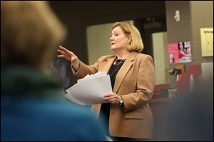 State Rep. Teresa Fedor (D., Toledo) speaks with area residents during a forum about the state education plan at Start High School. The Ohio Department of Education will delay sending a plan to the federal government after calls by legislators to do so.