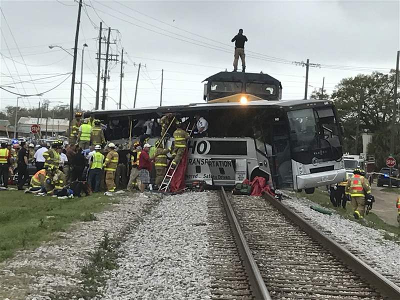 Train hits bus, killing 4; rescuers cut through wreckage The Blade