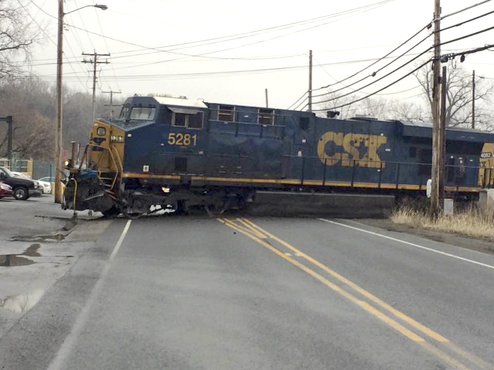 Crews put derailed freight train with hazardous load back on track