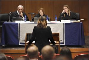 Judges Thomas Osowik, Arlene Singer, and Christine Mayle, from left, listen while Charlyn Bohland, an assistant state public defender, speaks about Kassi Brandeberry’s sentence.