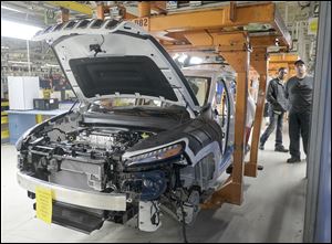 The last Jeep Cherokee produced in Toledo makes it's way through the assembly line Thursday, April 6, 2017, at the Toledo Assembly Complex in Toledo, Ohio.