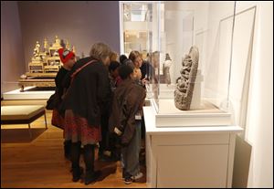 A school group looks at statues at the University of Michigan Museum of Art. The facility, which was founded in 1856, attracts about 250,000 visitors each year.