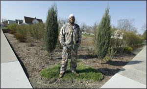 Urban farmer Thomas Jackson stands on his tilled lots at 1505 Milburn Ave. in Toledo.