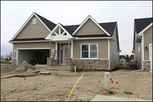  Construction continues at Perrysburg’s River’s Edge. Builders say popular single-family home sizes start with 1,500 square feet and end at about 3,000 square feet.