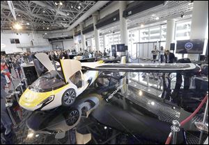 AeroMobil displays its latest prototype of a flying car in Monaco. The light frame plane whose wings can fold back like an insect is boosted by a rear propeller.