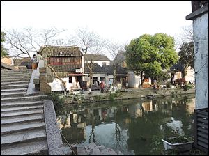 Tourists to Shanghai, where the art of silk making was developed, can view the popular Water City nearby.