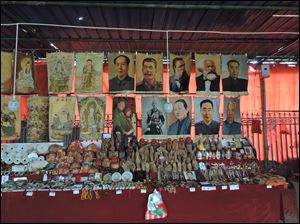 While China has moved away from the communism of Karl Marx and Mao Zedong, those leaders still cast a long shadow on the country. Posters of past communist leaders are for sale in a gift shop.